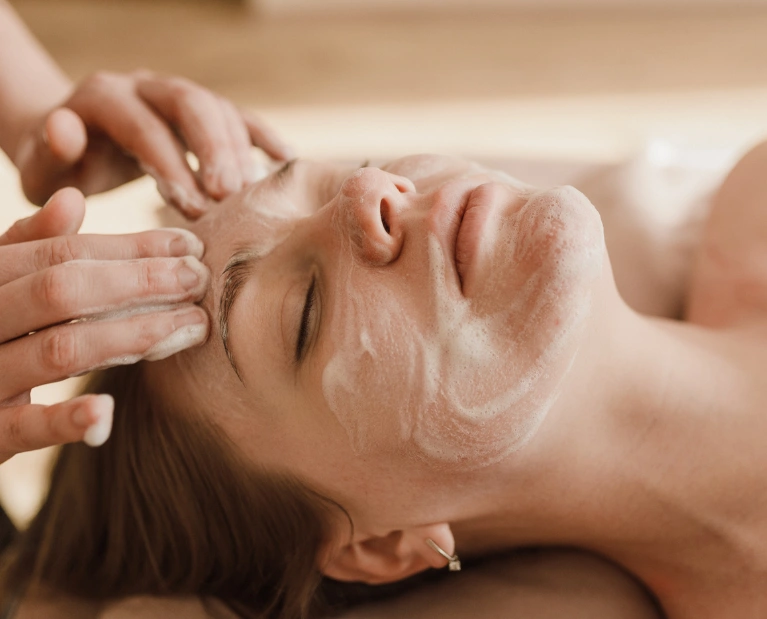 Woman receiving a facial treatment